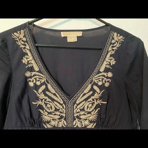 Dark blue top with tan embroidery